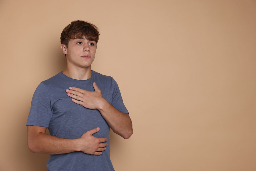 Teenager using deep breathing technique