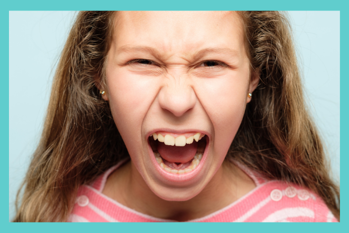 Angry teenage girl screaming; anger