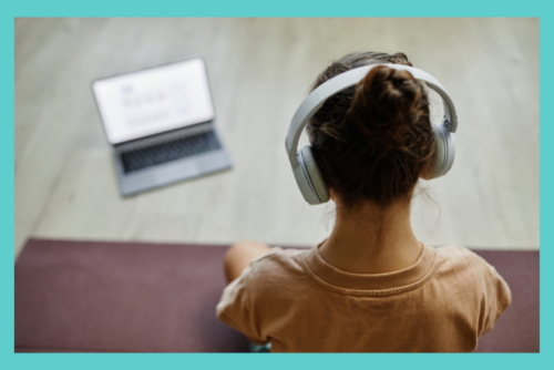 neurodivergent teen sitting in silence with headphones covering their ears