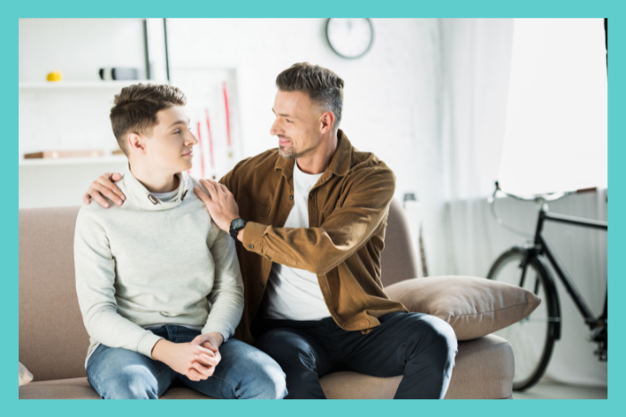 Progress in therapy - a father and son sitting together happy since the son is progressing in therapy